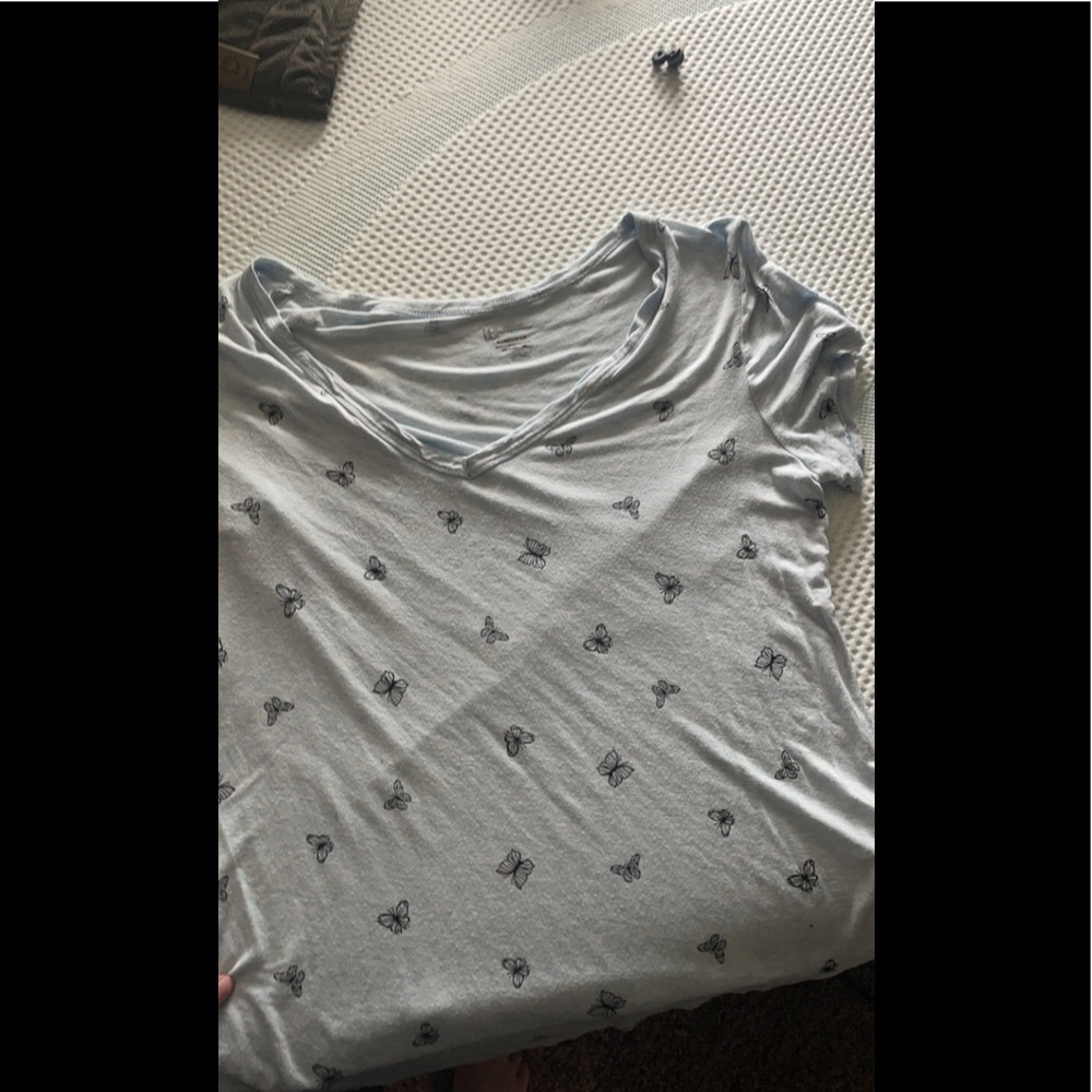 V neck light blue T-shirt with black butterflies.light and see through material.